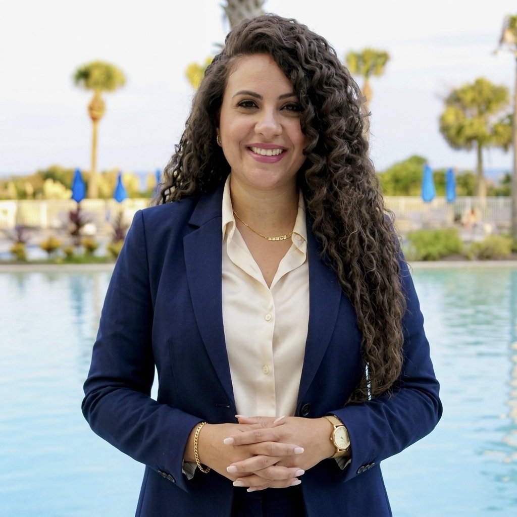 Marina Iskander, life coach, smiling warmly by the water